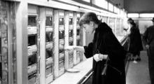 The actress Audrey Hepburn ordering food from an automat