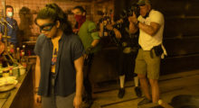 Jules O'Loughlin lines up a shot on the set of Ms. Marvel.