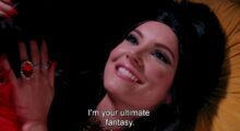 A woman with dark hair smiling and saying the words, "I'm your ultimate fantasy."