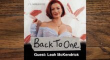 A director and actor, Leah McKendrick, of the film "Scrambled": a white woman with red hair in a purple gown.