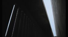 A from-below view of a brutalist building's ceiling.