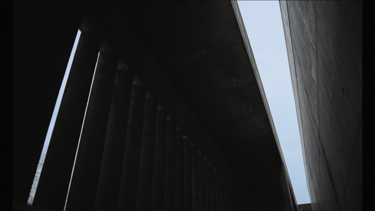 A from-below view of a brutalist building's ceiling.