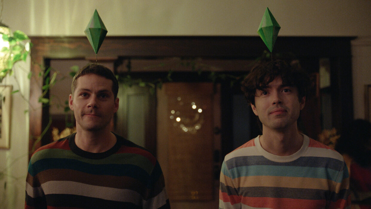 Two-shot of a pair of men in colorful striped shirts look