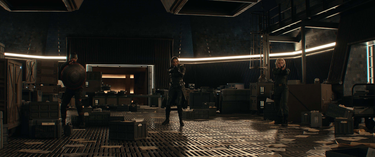 A woman with a gun in a vault.