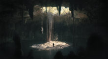 A beam of sunlight radiates town into a dark cavern, where a person stands and looks incredibly small amid the massive, dark space.