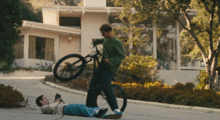 Two boys, one bike.