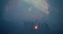 Children cluster around a small fire in a smoggy quarry.
