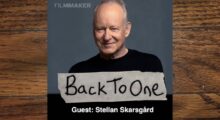 Swedish actor Stellan Stellan Skarsgård wears a black shirt in his headshot.