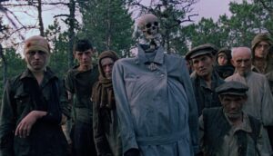 A group of Belarusian villagers and child soldiers circa WWII don filthy military regalia and have even dressed a skeleton in an overcoat.